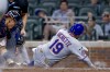 Atlanta Braves catcher Drake Baldwin, left, tags out New York Mets' Bo Bichette (19) at home plate during the sixth inning of a baseball game, Monday, July 6, 2026, in Atlanta. (AP Photo/Erik S. Lesser)