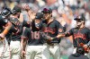 San Francisco Giants right fielder Jung Hoo Lee (51), middle, reacts after winnning a baseball game against the Colorado Rockies Saturday, July 11, 2026, in San Francisco. (AP Photo/Thien-An Truong)