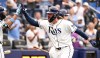 Tampa Bay Rays' Ryan Vilade, front right, celebrates after his three-run home run during the seventh inning of a baseball game against the Seattle Mariners, Saturday, July 11, 2026, in St. Petersburg, Fla. (AP Photo/Jason Behnken)