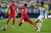 Switzerland's Breel Embolo (7) reacts as he dives in a challenge from Argentina's Leandro Paredes (5) for which he got a second yellow card during the World Cup quarterfinal soccer match between Argentina and Switzerland in Kansas City, Mo., Saturday, July 11, 2026. (AP Photo/Ashley Landis)