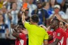 Referee Joao Pinheiro, of Portugal, gives a red card for Switzerland's Breel Embolo (7), left, during the World Cup quarterfinal soccer match between Argentina and Switzerland in Kansas City, Mo., Saturday, July 11, 2026. (AP Photo/Ed Zurga)