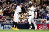 San Diego Padres' Ty France, right, is congratulated by third base coach Bob Henley, left, as he rounds the bag after hitting a solo home run against the Toronto Blue Jays in the sixth inning of a baseball game Saturday, July 11, 2026, in San Diego. (AP Photo/Derrick Tuskan)