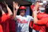 Philadelphia Phillies' J.T. Realmuto celebrates after scoring against the Detroit Tigers during the third inning Sunday, July 12, 2026, in Detroit. (AP Photo/Paul Sancya)