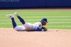 New York Mets shortstop Francisco Lindor dives for a ball hit by Boston Red Sox's Romy Gonzalez, leading Red Sox's Ceddanne Rafaela to reach second base, during the ninth inning of a baseball game Sunday, July 12, 2026, in New York. (AP Photo/Pamela Smith)