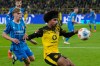 FILE - Dortmund's Karim Adeyemi controls the ball during the German Bundesliga soccer match between Borussia Dortmund and FC Heidenheim in Dortmund, Germany, on Feb. 1, 2026. Barcelona has reached a deal to sign Borussia Dortmund forward Karim Adeyemi, according to club president Joan Laporta. (AP Photo/Martin Meissner, FILE)