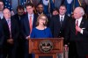 Newly appointed U.S. interim Senator, Darline Graham Nordone, with South Carolina Gov. Henry McMaster, right, speaks to members of the press after being appointed of to fill the vacancy created by the passing of her brother, U.S. Senator Lindsey Graham, at the statehouse Monday, July 13, 2026, in Columbia, S.C. (AP Photo/Sean Rayford)