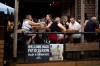 People dine on the patio of a pub in the ByWard Market in Ottawa, on Friday, June 23, 2023. THE CANADIAN PRESS/Justin Tang