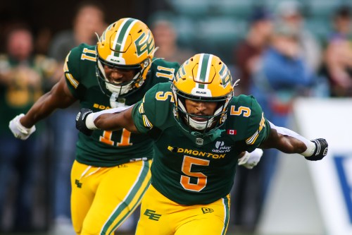 Edmonton Elks' Justin Rankin (5) and Kaion Julien-Grant (11) celebrate a touchdown against the Ottawa Redblacks during second half CFL football action in Edmonton on Thursday, July 9, 2026. THE CANADIAN PRESS/Codie McLachlan