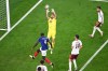 Spain goalkeeper Unai Simon (23) makes a save over France's Dayot Upamecano (4) during the World Cup semifinal soccer match in Arlington, Texas, near Dallas, Tuesday, July 14, 2026. (AP Photo/Jessica Tobias)