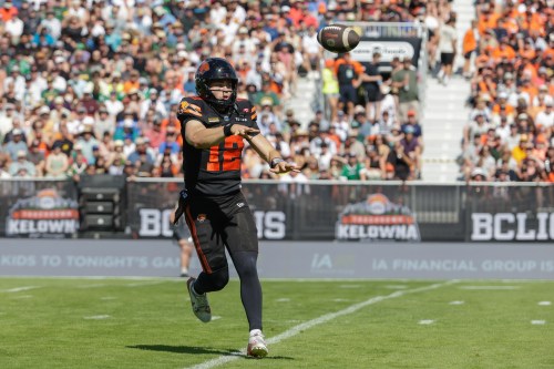 B.C. Lions' quarterback Nathan Rourke (12) throws for a first down against the Edmonton Elks during first-half CFL football action in Kelowna, B.C., on Saturday, July 4, 2026. THE CANADIAN PRESS/Steve Dunsmoor