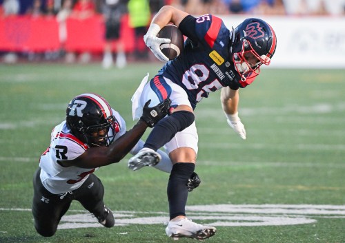 Montreal Alouettes' Tyler Snead (85) breaks away from a tackle by Ottawa Redblacks' Jeremy Lucien (31) during second half CFL football action in Montreal, on Sunday, June 28, 2026. THE CANADIAN PRESS/Graham Hughes