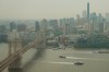 Boats maneuver the East River near the Brooklyn Bridge as smoke from wildfires blankets the sky Thursday, July 16, 2026, in New York. (AP Photo/Alyssa Goodman)