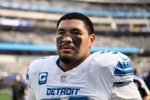 FILE - Detroit Lions offensive tackle Penei Sewell (58) walks back to the locker room before an NFL football game against the Los Angeles Rams, Dec. 14, 2025, in Inglewood, Calif. (AP Photo/Kyusung Gong, File)