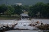 Flooding blocks off G Street along the Guadalupe River on Thursday, July 16, 2026, in Kerrville, Texas. (AP Photo/Joel Angel Juarez)