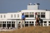 Jackson Suber of the United States, and his caddie Greyson Porter walks towards the 18th green during the first day of the British Open Golf championships at Royal Birkdale golf club, in Southport, England, Thursday, July 16, 2026. (AP Photo/Peter Morrison)