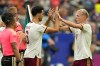 Spain's Dani Olmo, right, greets teammate Mikel Merino (6) as Olmo is replaced by Merino during the World Cup semifinal soccer match between France and Spain in Arlington, Texas, near Dallas, Tuesday, July 14, 2026. (AP Photo/Ashley Landis)