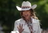Parade Marshal Shania Twain rides a horse during the Calgary Stampede parade in Calgary, Friday, July 4, 2025. THE CANADIAN PRESS/Jeff McIntosh