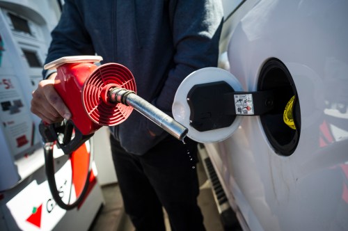 A man prepares to pump gas in Toronto, on April 1, 2019. THE CANADIAN PRESS/Christopher Katsarov