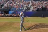 Sam Burns of the United States acknowledges the crowd after holding out from a bunker on the 18th green during the second day of the British Open Golf championships at Royal Birkdale golf club, in Southport, England, Friday, July 17, 2026. (AP Photo/Peter Morrison)