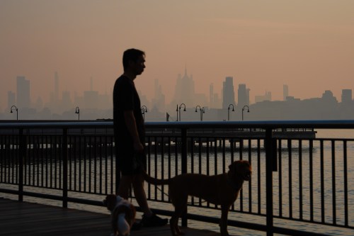 The New York City skyline is seen through a cover of wildfire smoke, in Jersey City, N.J., Friday, July 17, 2026. (AP Photo/Ryan Murphy)