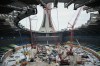 Cranes are shown inside the Olympic Stadium during the replacement of the original roof in Montreal, Thursday, Jan. 8, 2026. THE CANADIAN PRESS/Graham Hughes