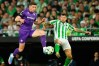 FILE - Fiorentina's Robin Gosens, left, and Betis' Aitor Ruibal fight for the ball during the Conference League semifinal first leg soccer match between Betis and Fiorentina at the Benito Villamarin stadium in Seville, Spain, May 1, 2025. (AP Photo/Jose Breton, File)