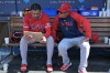 FILE - Los Angeles Angels' Jose Siri, left, looks at an iPad in the dugout with Angels' assistant hitting coach Jobel Jiménez during a baseball game against the Los Angeles Dodgers, June 7, 2026, in Los Angeles. (AP Photo/Jayne Kamin-Oncea, File)