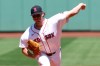 Boston Red Sox pitcher Jake Bennett throws during the first inning of the first baseball game of a doubleheader against the Tampa Bay Rays, Friday, July 17, 2026, in Boston. (AP Photo/Mark Stockwell)