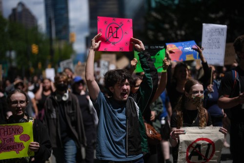 People participate in a march in Vancouver to protest the opening of AI data centres on Saturday, June 27, 2026. THE CANADIAN PRESS/Darryl Dyck
