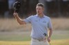 Justin Rose of England acknowledges the crowd after completing his second round on the 18th green during the second day of the British Open Golf championships at Royal Birkdale golf club, in Southport, England, Friday, July 17, 2026. (AP Photo/David Goldman)