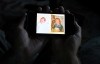 Jeremy Morrison, who says he was sent home with the wrong parents after he was born, shows what he believes is a baby photo of him, left, and of the other baby he says was switched at birth while recounting the story at his home in Colorado City, Colo., on Thursday, July 16, 2026. (AP Photo/Thomas Peipert)