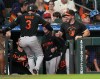 Baltimore Orioles' Taylor Ward (3) celebrates his go-ahead, two-run home run with teammates during the eighth inning of a baseball game against the Houston Astros, Friday, July 17, 2026, in Houston. (AP Photo/Karen Warren)