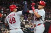 St. Louis Cardinals' JJ Wetherholt celebrates with Iván Herrera (48) after hitting a solo home run against the Arizona Diamondbacks in the fifth inning of a baseball game, Friday, July 17, 2026, in Phoenix. (AP Photo/Rick Scuteri)
