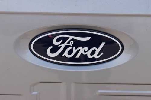The company logo is shown on the tailgate of an unsold 2026 F150 pickup truck sitting for sale outside a Ford agency Sunday, April 12, 2026, in Centennial, Colo. (AP Photo/David Zalubowski)