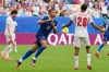 France's Kylian Mbappe (10) celebrates scoring his side's third goal as England's Jarell Quansah (26) reacts to the score during the World Cup third-place playoff soccer match between France and England in Miami Gardens, Fla., Saturday, July 18, 2026. (AP Photo/Rebecca Blackwell)