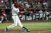 Arizona Diamondbacks' Nolan Arenado connects on a two-run double against the St. Louis Cardinals during the third inning of a baseball game, Saturday, July 18, 2026, in Phoenix. (AP Photo/Ross D. Franklin)