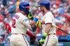 Philadelphia Phillies' Kyle Schwarber, left, celebrates his home run with Bryce Harper, right, during the first inning a baseball game against the New York Mets, Saturday, July 18, 2026, in Philadelphia. (AP Photo/Chris Szagola)