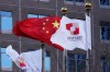 FILE - Flags of the China Development Bank are flown near a Chinese flag outside a subsidiary branch office of the Bank in Beijing, Jan. 8, 2021. (AP Photo/Ng Han Guan, File)