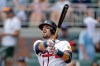Atlanta Braves' Austin Riley follows through on a solo home run against the Texas Rangers during the second inning of a baseball game, Sunday, July 19, 2026, in Atlanta. (AP Photo/Erik S. Lesser)