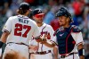 Atlanta Braves third baseman Austin Riley (27) reacts with first baseman Matt Olson, center, and catcher Drake Baldwin, right, after the team defeated the Texas Rangers in a baseball game, Sunday, July 19, 2026, in Atlanta. (AP Photo/Erik S. Lesser)