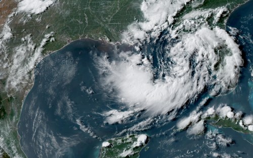 This satellite image from the National Oceanic and Atmospheric Administration shows a tropical depression in the Gulf of Mexico, Sunday, July 19, 2026. (NOAA via AP)
