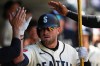Seattle Mariners' Luke Raley celebrates in the dugout after hitting a solo home run against the San Francisco Giants during the sixth inning of a baseball game, Sunday, July 19, 2026, in Seattle. (AP Photo/Lindsey Wasson)