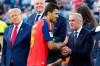 Spain midfielder Rodri (16) shakes hands with Canadian Prime Minister Mark Carney during the trophy presentation following Spain's win of the FIFA World Cup final, in East Rutherford, N.J., Sunday, July 19, 2026. THE CANADIAN PRESS/Frank Gunn