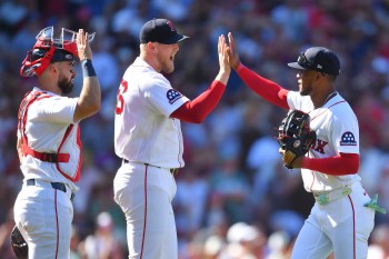 Boston Red Sox's Connor Wong, left, Ryan Watson, center, and Ceddanne Rafaela, right, celebrate after their team's win over the Tampa Bay Rays in a baseball game, Sunday, July 19, 2026, in Boston. (AP Photo/Steven Senne)