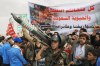 Houthi supporters hold a rally in Sanaa, Yemen, Friday, July 17, 2026, against the Saudi-led coalition. Banner in Arabic reads, 