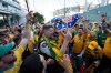 Australia fans surround an RCMP officer as they march to the entrance of B.C. Place before the first half of a World Cup Group D soccer match, in Vancouver, on Saturday, June 13, 2026. THE CANADIAN PRESS/Ethan Cairns
