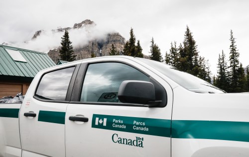 A Parks Canada vehicle sits parked at Bow Lake near Bow Glacier Falls in Banff National Park on Friday, June 20, 2025. THE CANADIAN PRESS/Jeff McIntosh