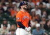Houston Astros' Christian Walker reacts after getting hit by a pitch on his hand by Baltimore Orioles relief pitcher Anthony Nunez during the sixth inning of a baseball game, Friday, July 17, 2026, in Houston. (AP Photo/Karen Warren)