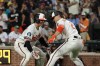 Baltimore Orioles' Gunnar Henderson (2) celebrates with Adley Rutschman, left, after hitting a home run off Kansas City Royals pitcher Eli Morgan during the eighth inning of a baseball game, Saturday, July 11, 2026, in Baltimore. (AP Photo/Terrance Williams)