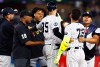 Pittsburgh Pirates' Gregory Soto, left, exchanges words with New York Yankees' José Caballero (72), right, during the ninth inning of a baseball game, Monday, July 20, 2026 in New York. (AP Photo/Noah K. Murray)